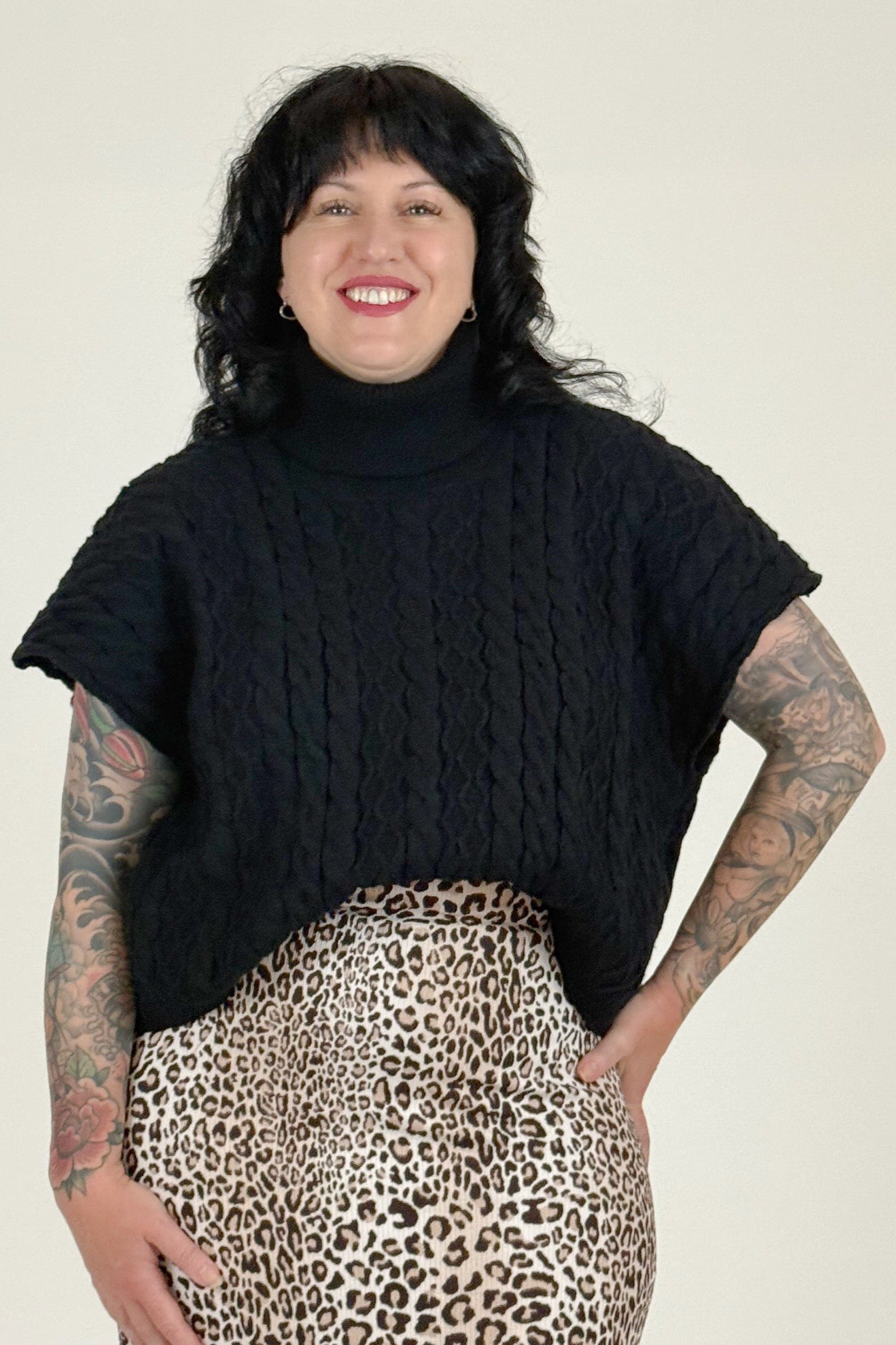 Women wearing black sweater with leopard skirt