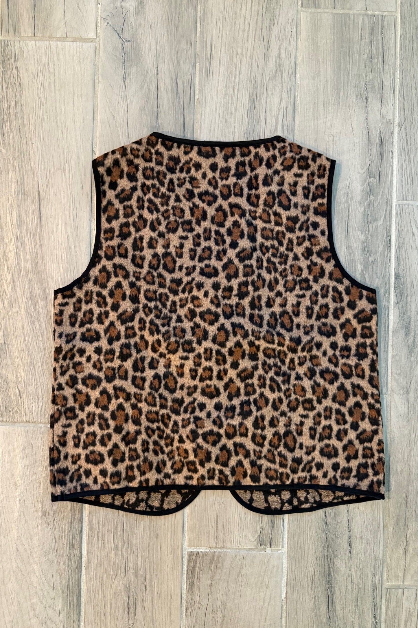 Leopard print garment on a wooden floor