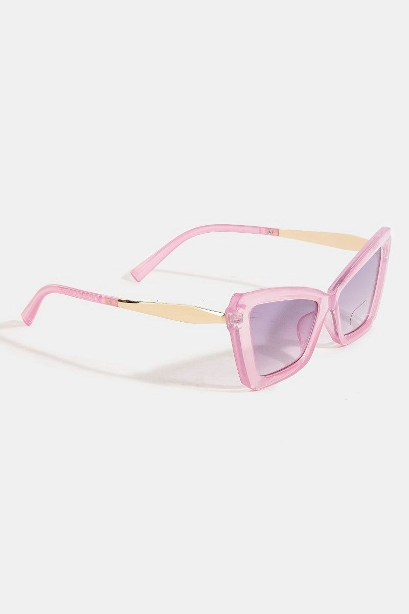 Pink sunglasses with a gradient effect on a white background
