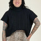Women wearing black sweater with leopard skirt