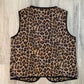Leopard print garment on a wooden floor