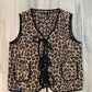 Leopard print bra and panties set on a wooden floor