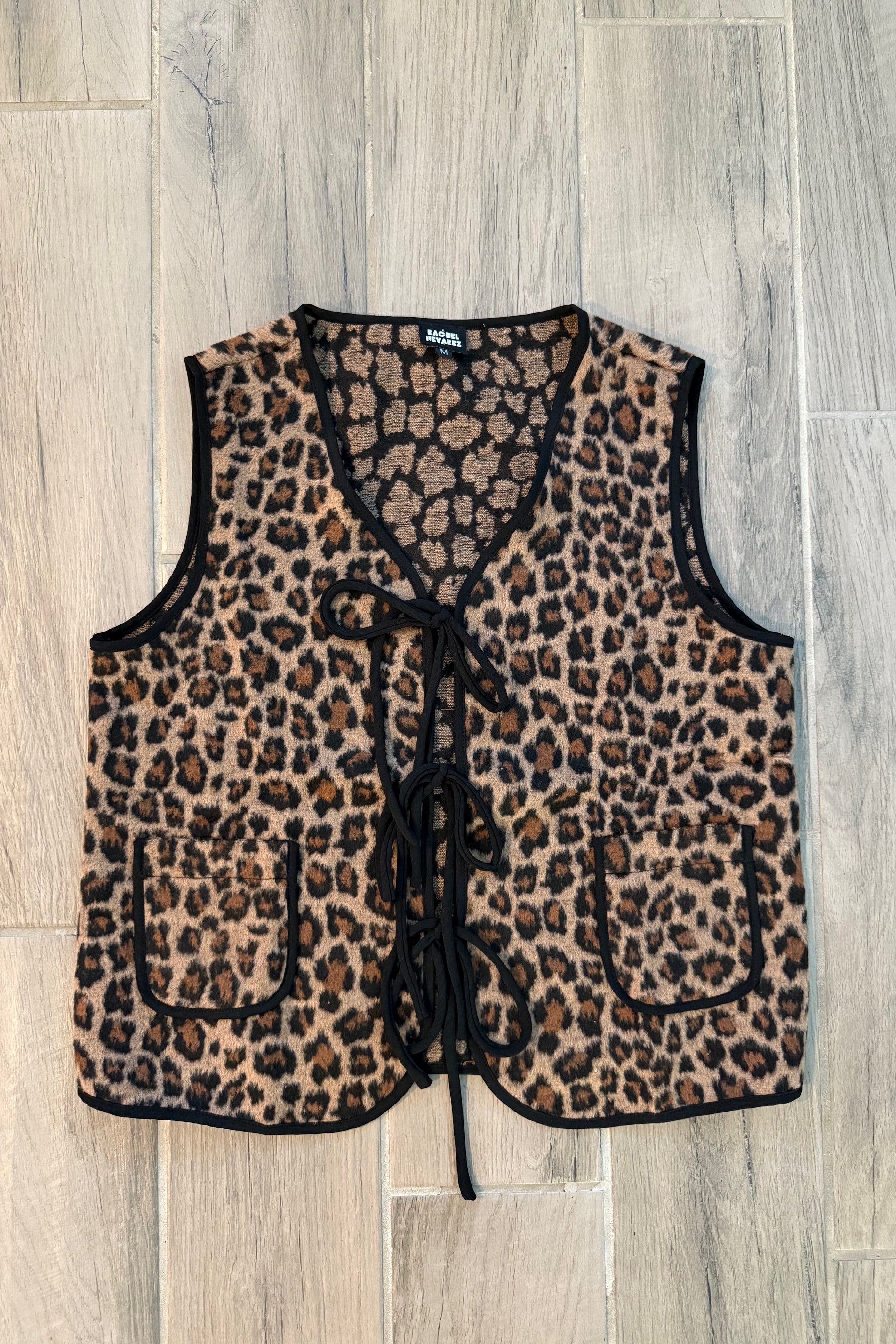 Leopard print bra and panties set on a wooden floor