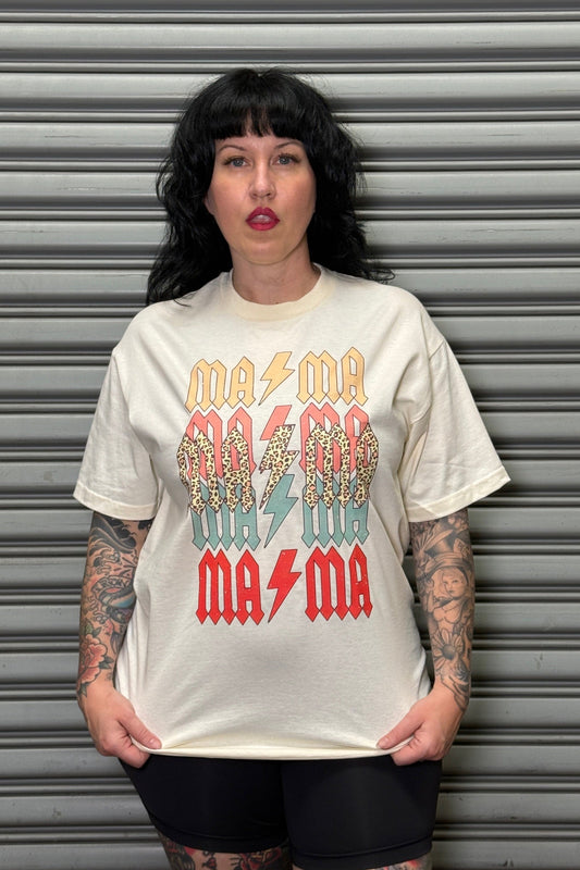 Person wearing a white t-shirt with colorful text and graphics against a gray background