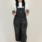 women wearing black distressed overalls