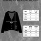 Vintage check cardigan measurement chart with size chart on a gray marble background