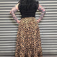 Back view of the Wild Heart leopard print tiered maxi skirt showing the flowy design and comfortable waistband.