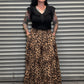 Front view of the Wild Heart leopard print maxi skirt featuring a tiered design and side pockets.