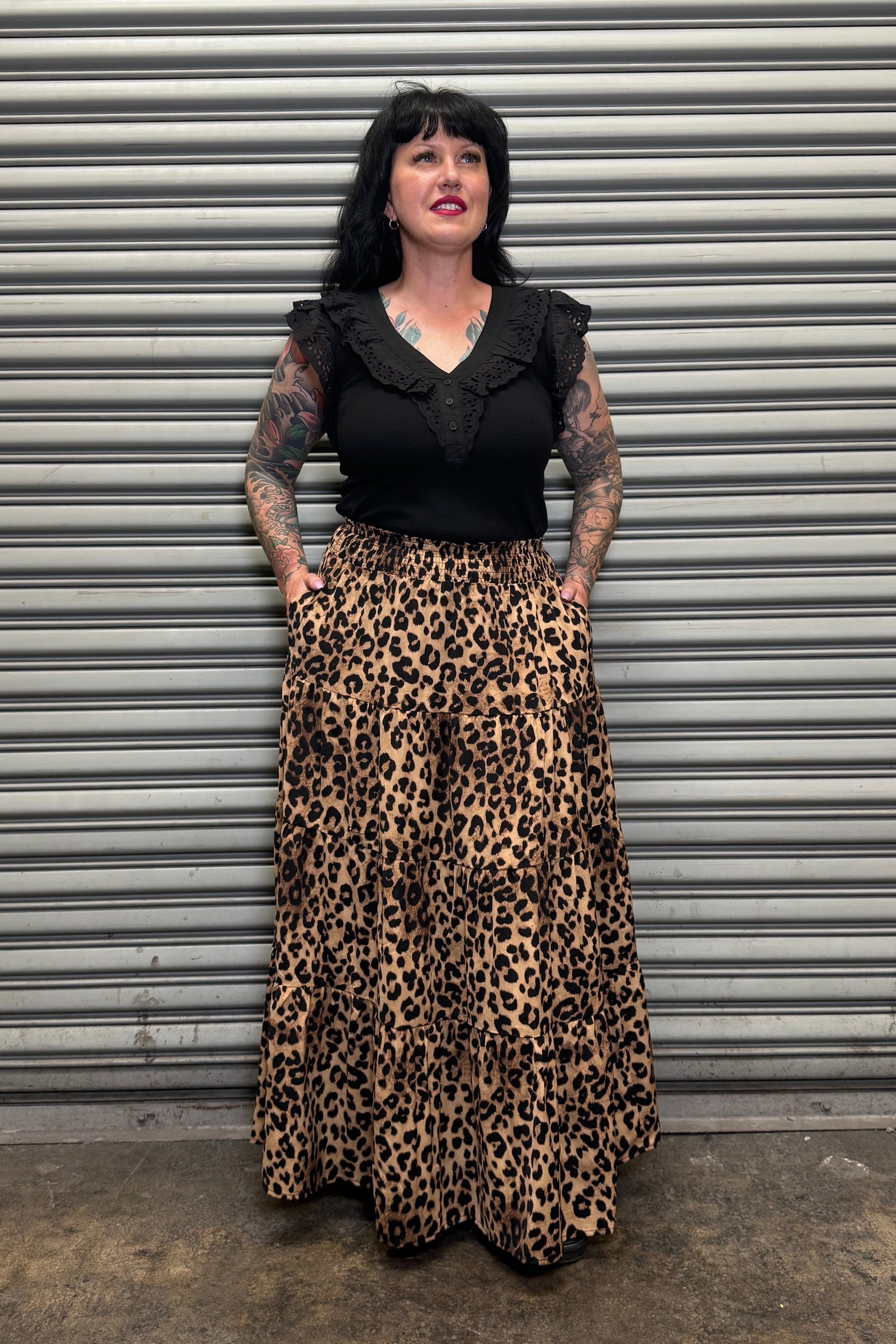 Front view of the Wild Heart leopard print maxi skirt featuring a tiered design and side pockets.